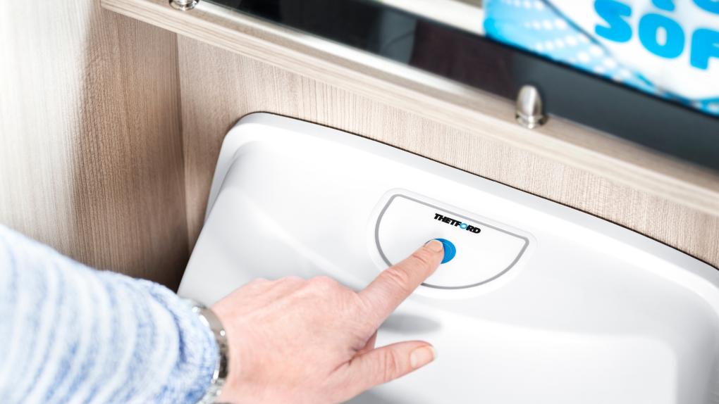 finger pressing flush thetford cassette toilet
